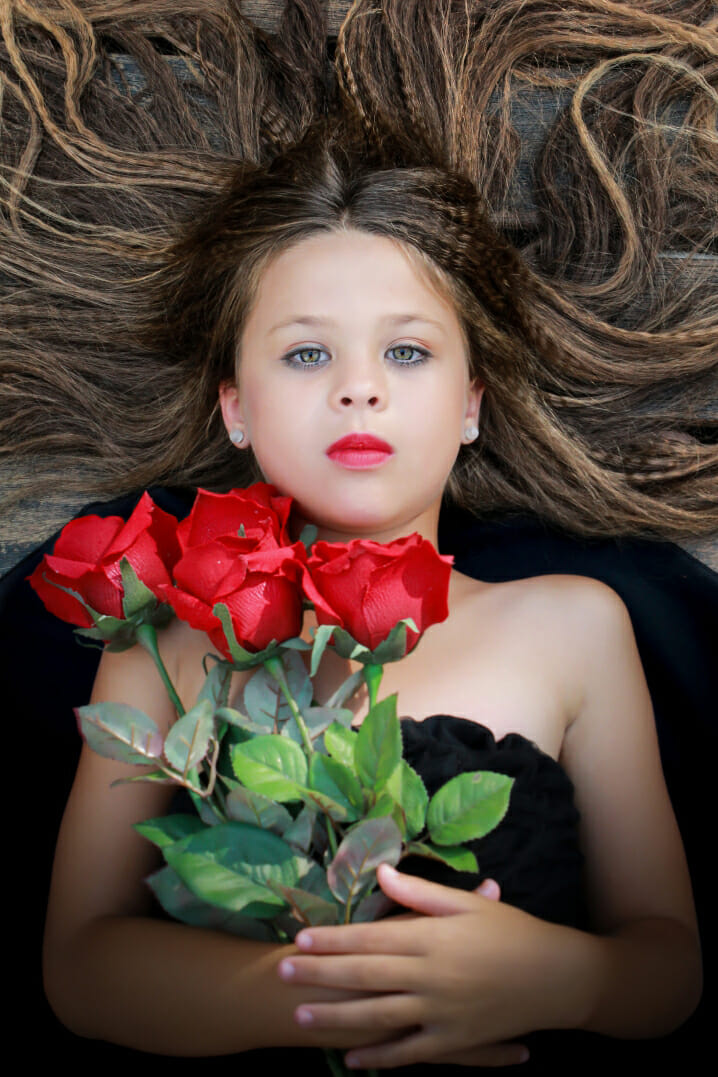 girl portrait red roses flowers hair crinkley overhead angle photography