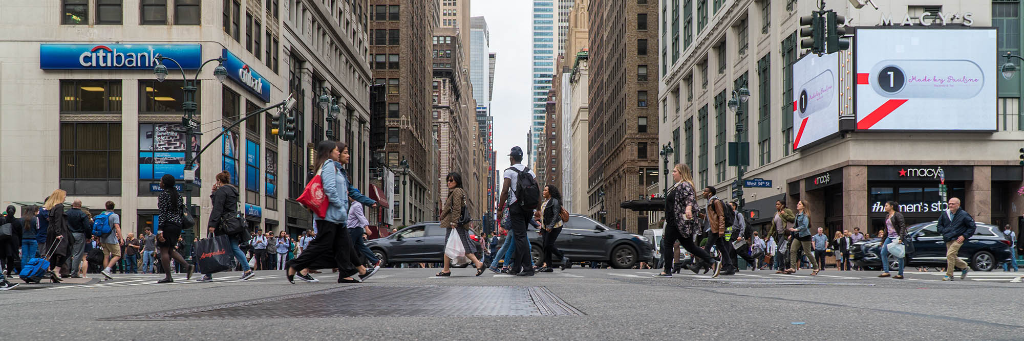 low angle city panorama cross walk road tarmac walking crowded street photography portrait city people camera subject light how to tutorial guide