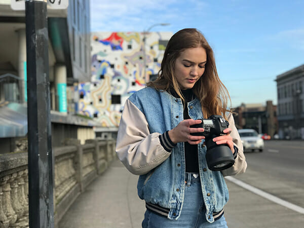 young lady with her camera share your tips