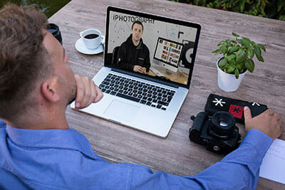 man watching video critique feedback