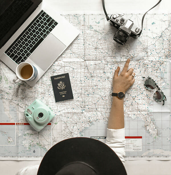 female reading map with camera landscape photography