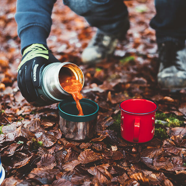 pouring coffee into cup outdoors landscape photography
