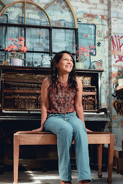 a woman by a broken piano a bad cropping example