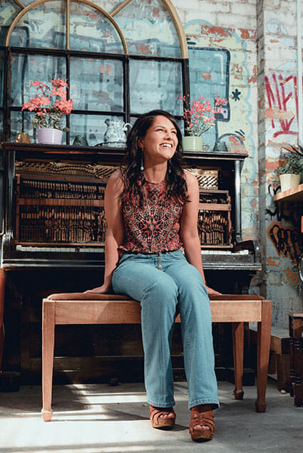 a good portrait cropping example a woman by a broken piano