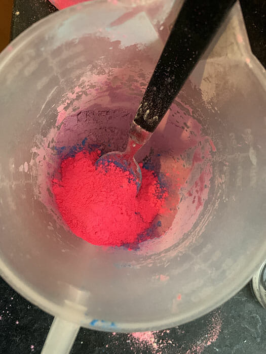 holi powder in a jug