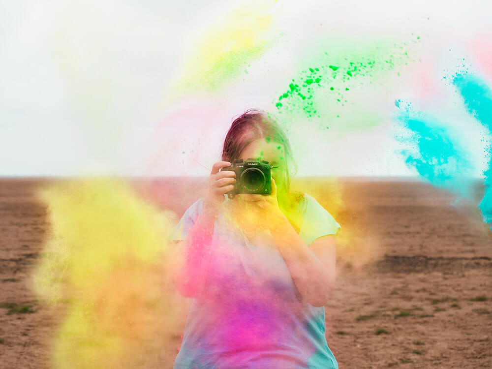 a woman being splashed with paint powder paint powder photography