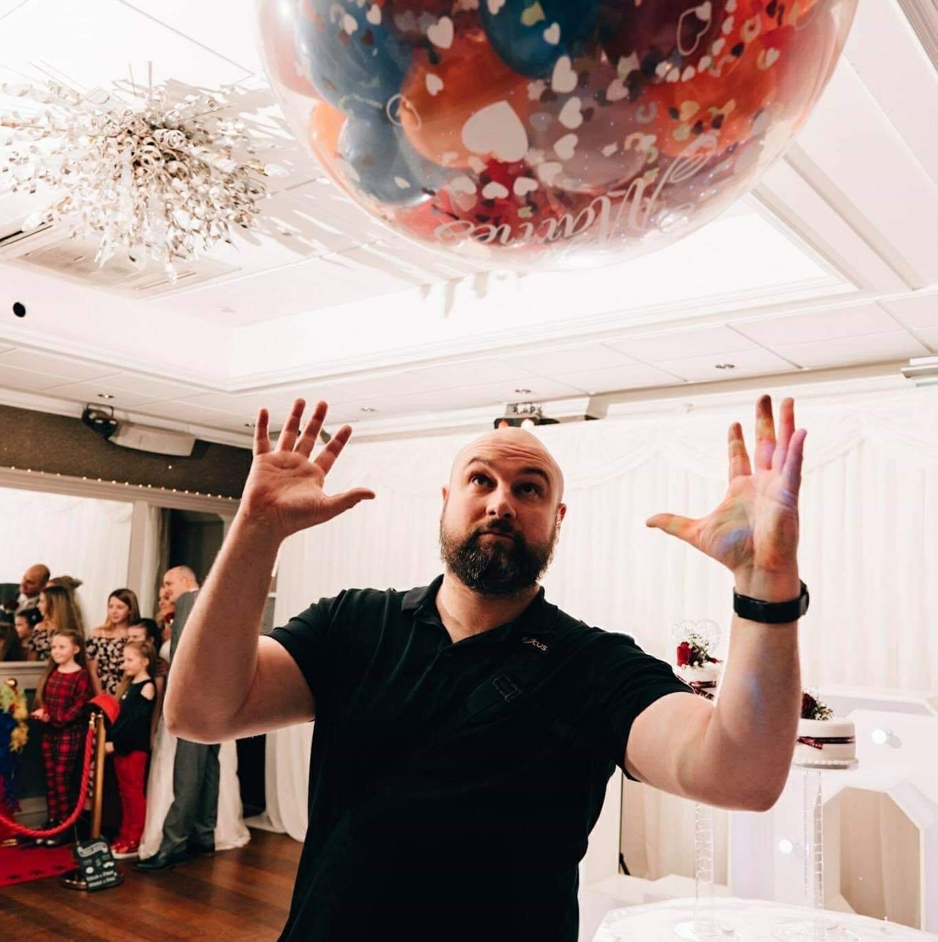 84898963_10156745793296720_7687167367285047296_o a wedding photographer trying to catch a balloon
