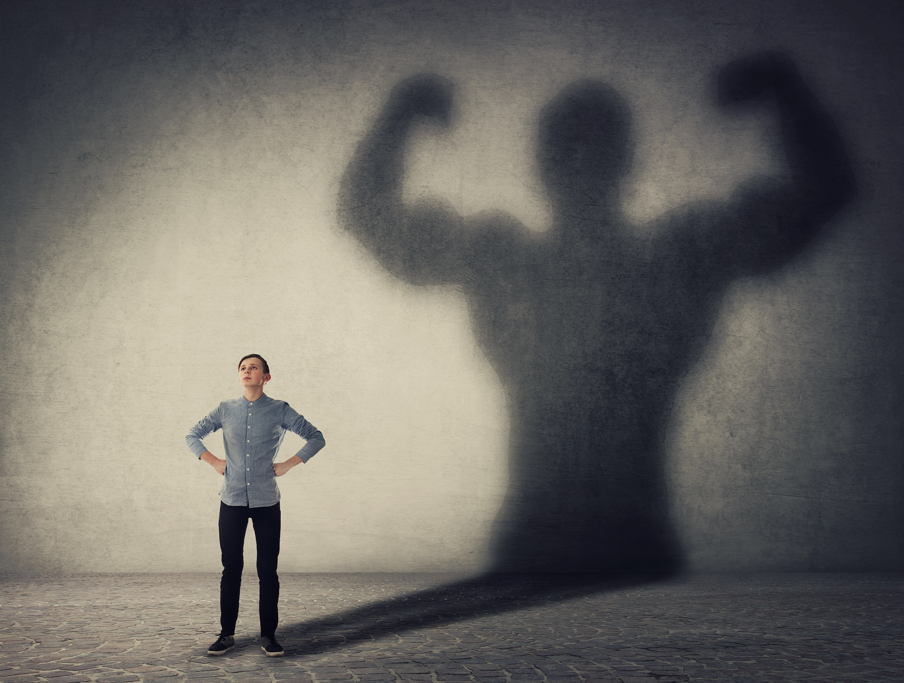 Screen Shot 2020-06-05 at 12.37.54 a man with his hands on his hips while his shadow shows him flexing and much larger