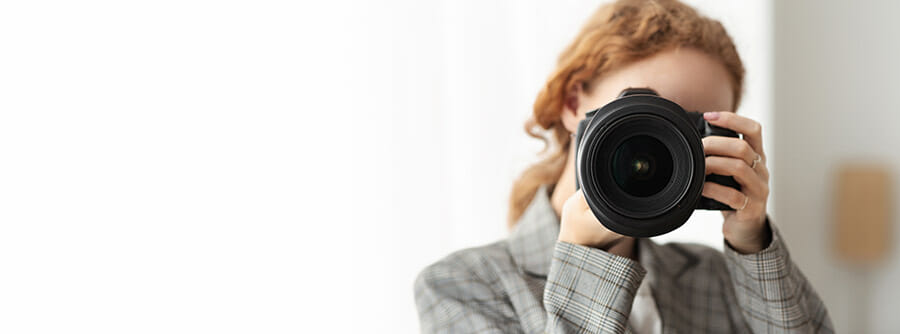 13. summary lady with camera red hair pointing at audience space to left