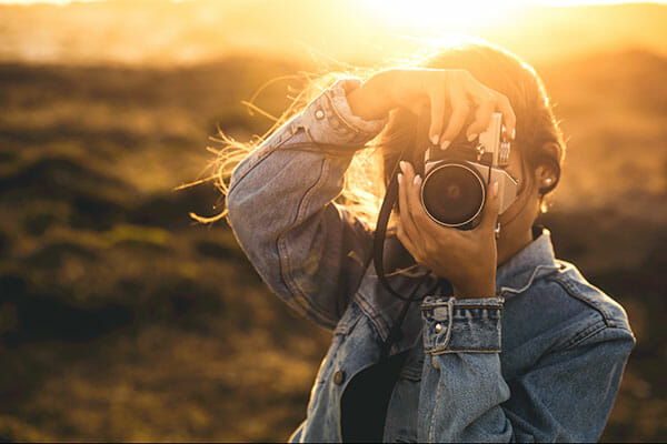 Beautiful,Woman,Taking,Picture,Outdoors,With,A,Analog,Camera Beautiful woman taking picture outdoors with a analog camera