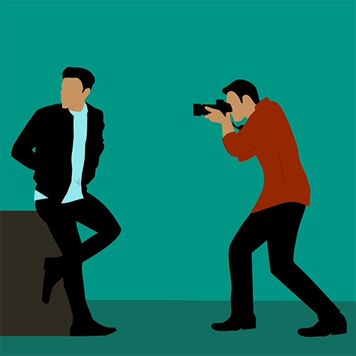 photographer taking portraits of man