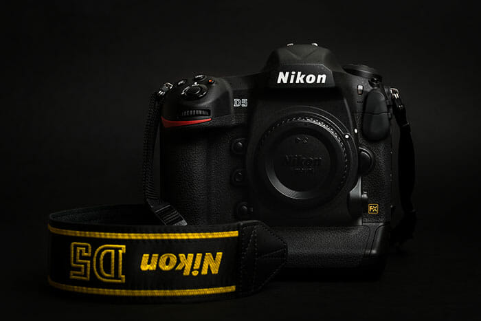 Prague,,Czech,Republic,-,April,25,,2016:,New,Professional,Top Nikon camera on black background D5 best camera for beginners