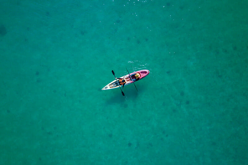 Aerial,Photo/bird's,Eye,View,-,A,Canoe,With,Two,Unknown minimalist photo iphotography rule of thirds example