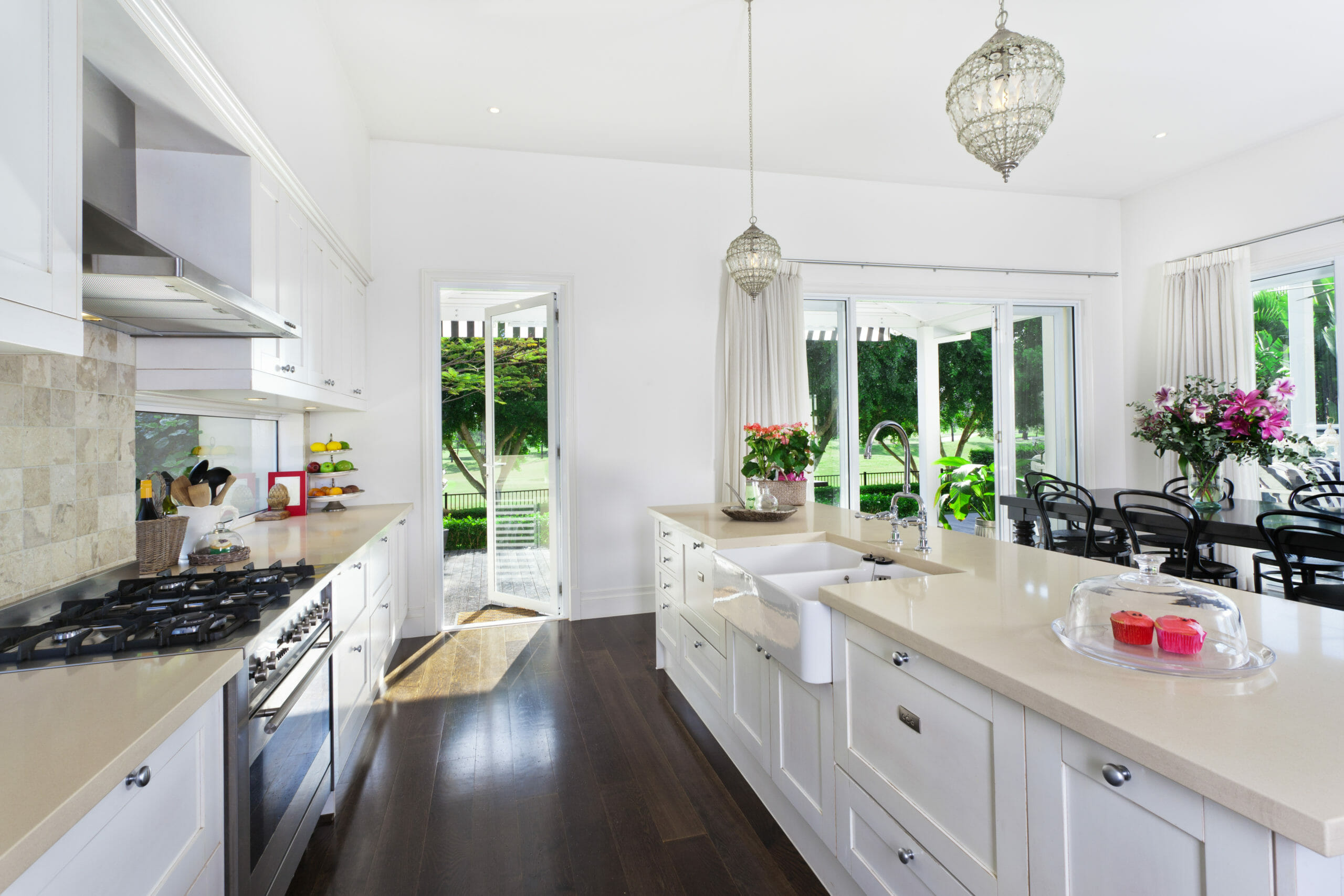 Stylish,Open,Plan,Kitchen,With,Stainless,Steel,Appliances,And,Dining Room Scene with Natural Light