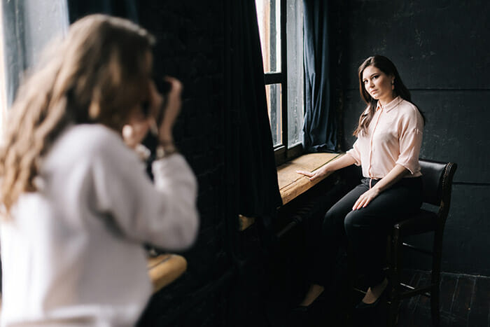 Woman,Model,Posing,While,Sitting,On,Chair,In,Photo,Studio Natural Light Photography Tutorial 11