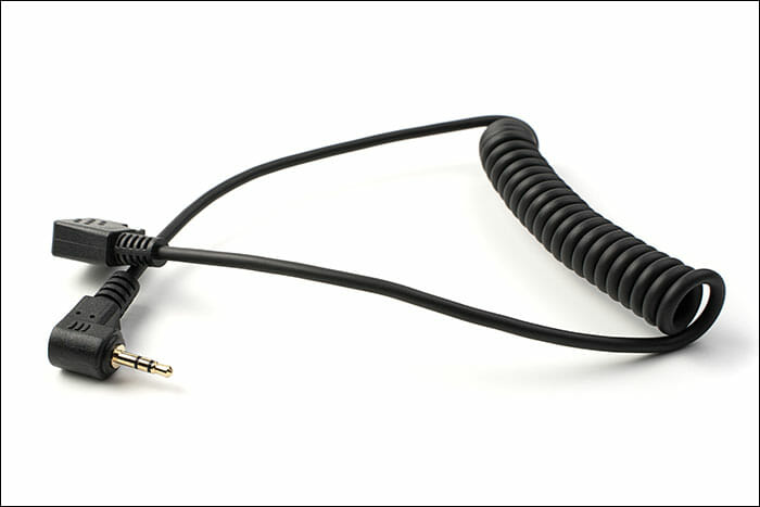 The,Connection,Cable,Is,Isolated,On,A,White,Background.,Concept Flash Photography Tutorial Flash Sync Cable 3