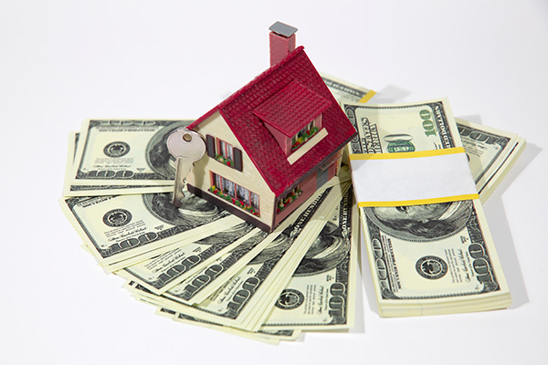 A,Small,House,Lies,On,A,Fan,Of,Hundred,Dollar