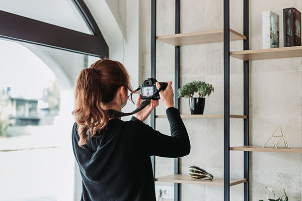 Female,Photographer,Photographing,Products,In,The,Office,With,Dslr,Camera Product Photography Tutorial