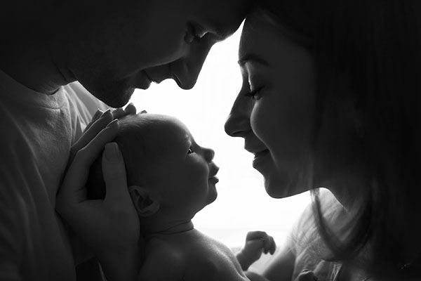 Happy,Family,With,Newborn,Baby,By,The,Window Newborn Photography Tutorial