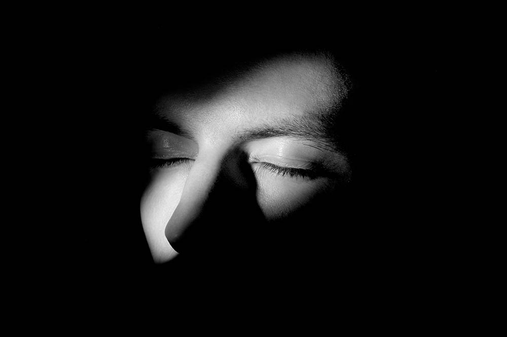 Black,And,White,Dramatic,Portrait,Of,A,Guy low light portraits example