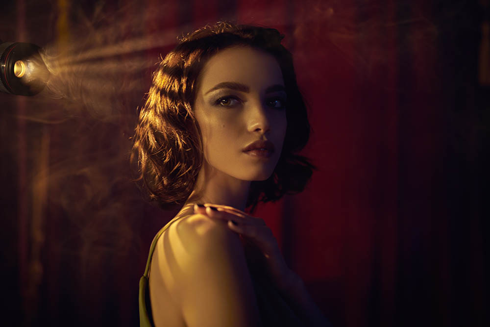 Portrait,Of,A,Charming,Brunette,Girl,In,A,Dark,Room,