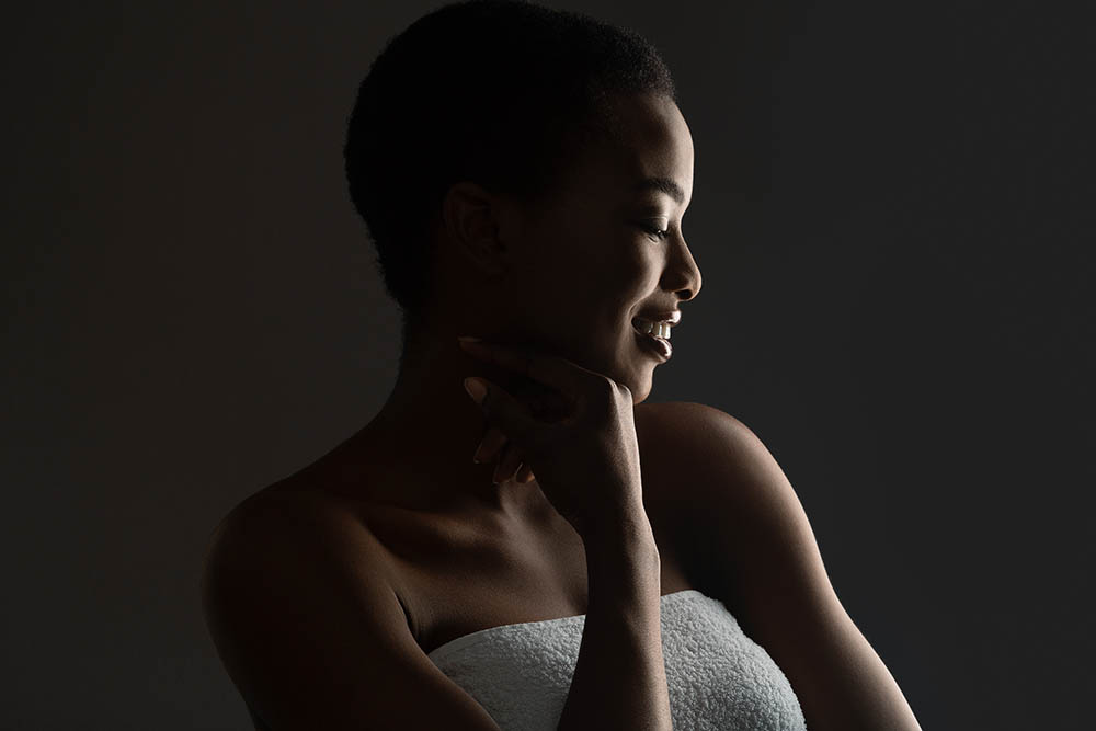 Woman,In,Shadow.,Portrait,Of,Beautiful,African,Girl,Wrapped,In